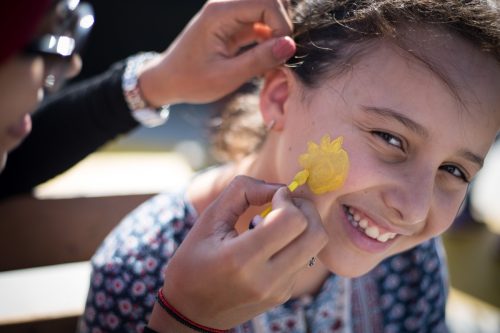 sol niña pintura facial energía solar